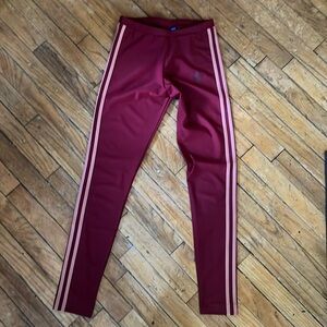 Adidas dusty rose stripes on maroon.
